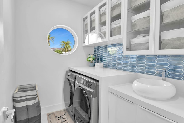 laundry area with sink and washing machine and dryer