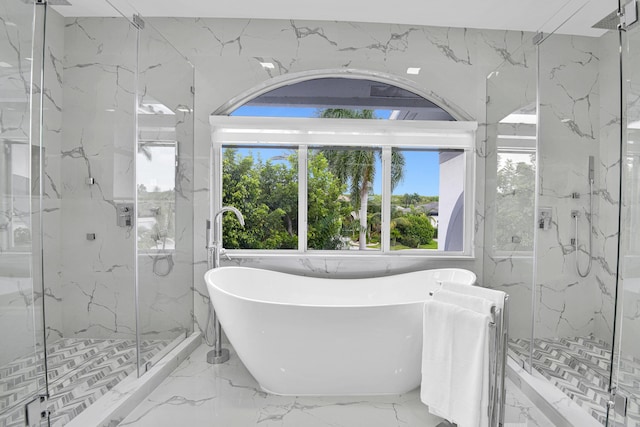 bathroom featuring separate shower and tub