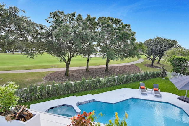 view of swimming pool featuring a lawn, an in ground hot tub, and a patio area