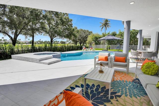 view of pool featuring an in ground hot tub and a patio