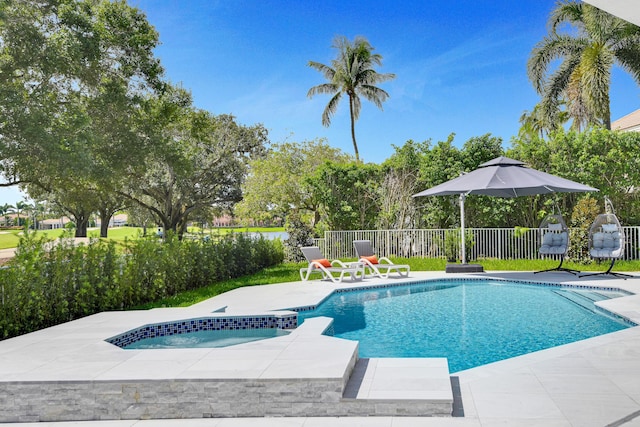 view of pool featuring an in ground hot tub and a patio area