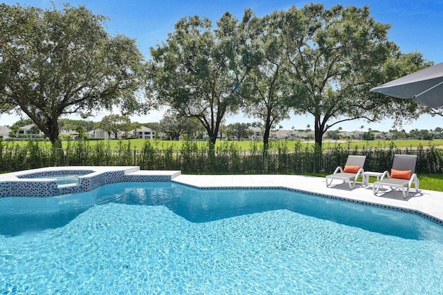 view of pool with a patio and an in ground hot tub