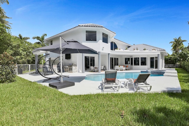 rear view of property with a patio area and a yard