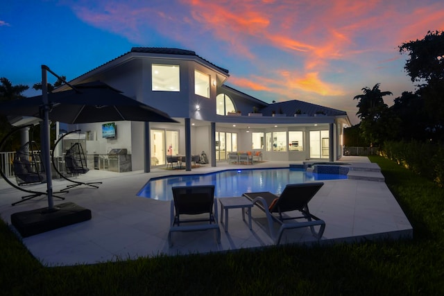 view of swimming pool with a patio area