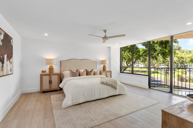 bedroom featuring light hardwood / wood-style floors, ceiling fan, and access to exterior