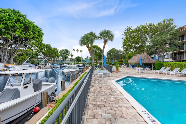 view of pool with a water view and a gazebo