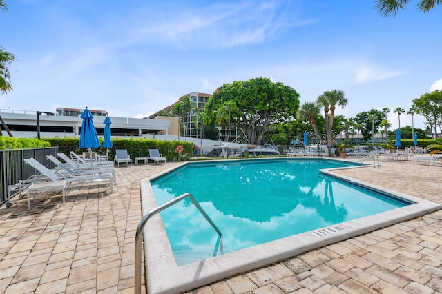 view of swimming pool with a patio