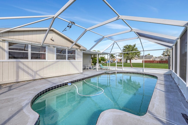 view of pool with a patio and a lanai