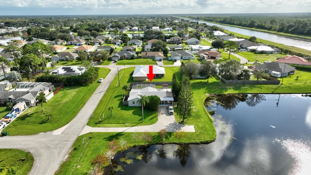 birds eye view of property featuring a water view