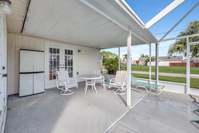 view of patio / terrace featuring french doors and a lanai