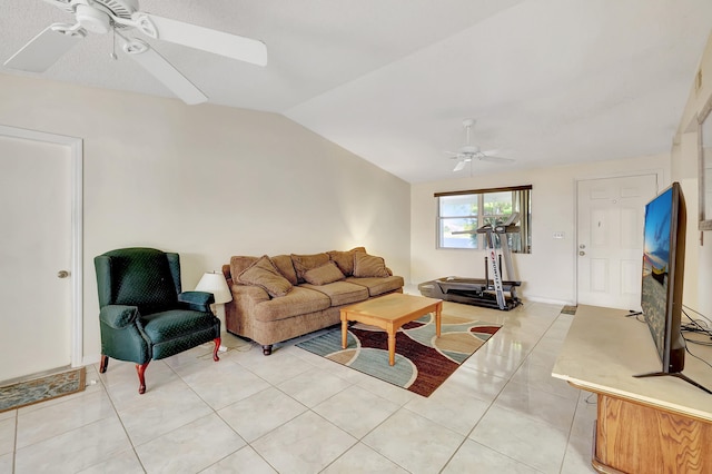 tiled living room featuring ceiling fan and vaulted ceiling