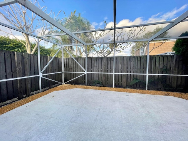 view of patio / terrace featuring a lanai