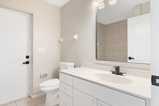 bathroom featuring vanity, toilet, and tile patterned floors