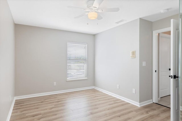 unfurnished room featuring ceiling fan and light wood-type flooring