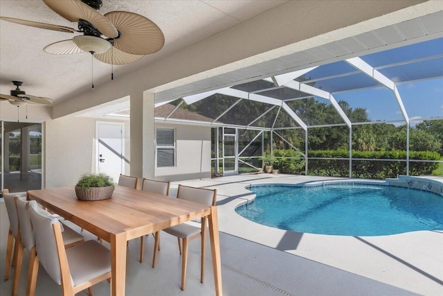 view of pool with a patio, a lanai, and ceiling fan