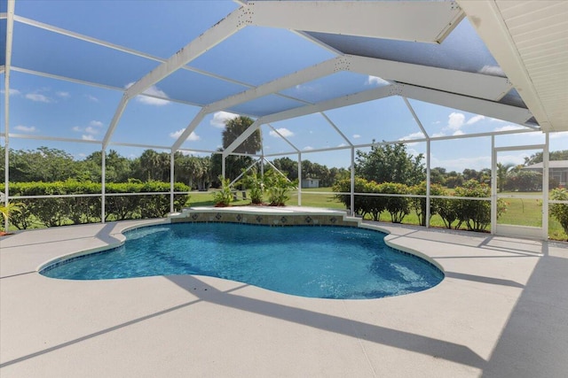 view of swimming pool featuring a lanai and a patio