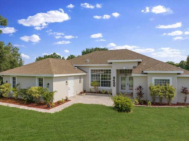 ranch-style house featuring a front lawn