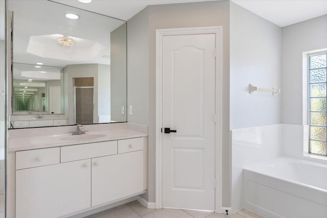 bathroom featuring shower with separate bathtub, vanity, plenty of natural light, and tile patterned flooring