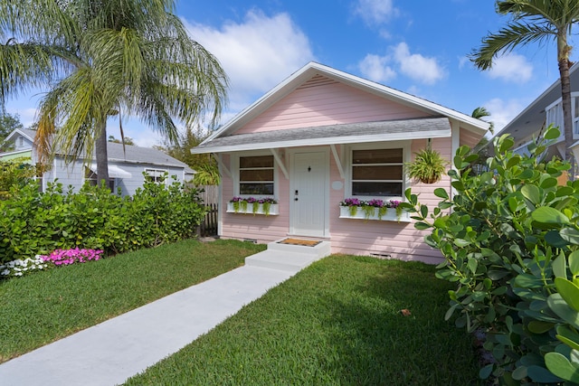 bungalow with a front yard