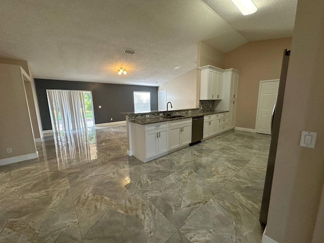 kitchen with white cabinetry, kitchen peninsula, dishwasher, a textured ceiling, and lofted ceiling