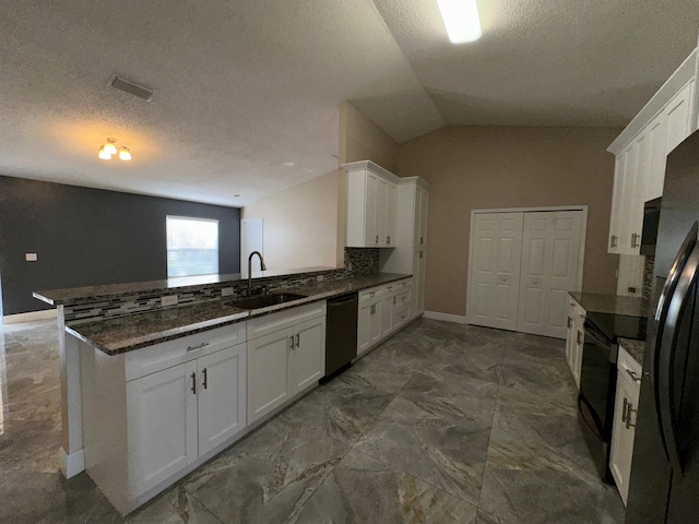 kitchen with lofted ceiling, sink, kitchen peninsula, black appliances, and white cabinetry