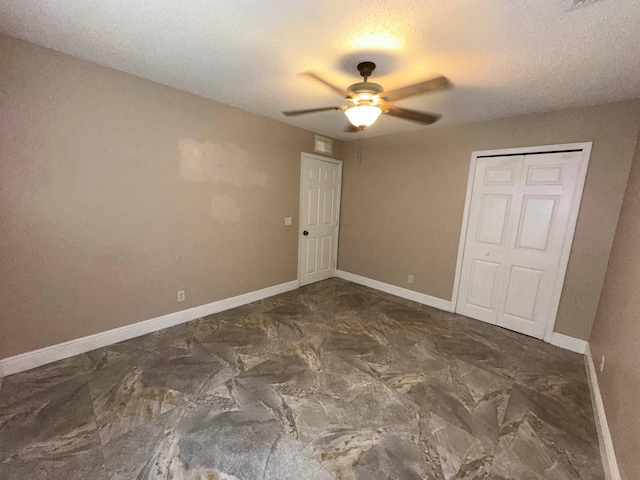 unfurnished bedroom featuring a closet, ceiling fan, and a textured ceiling