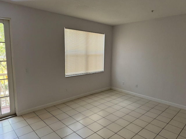 tiled spare room with a wealth of natural light