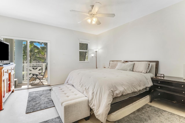 bedroom featuring access to outside, ceiling fan, and concrete floors