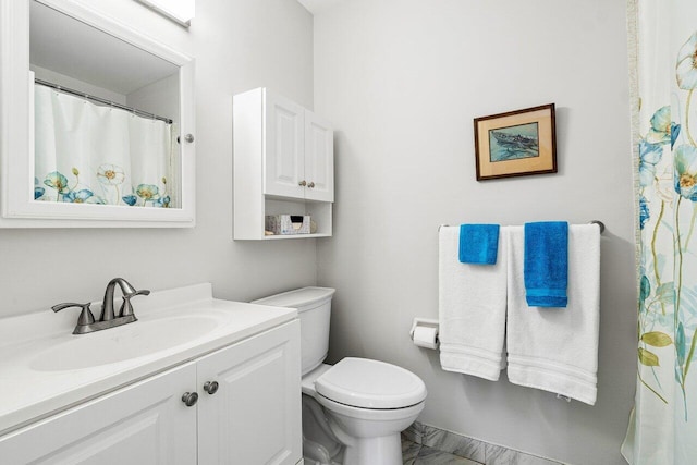 bathroom with vanity and toilet