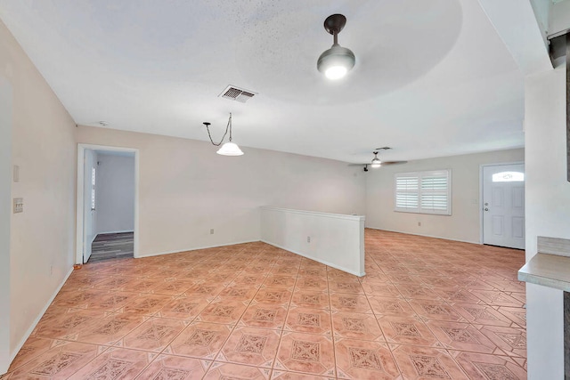 spare room with ceiling fan