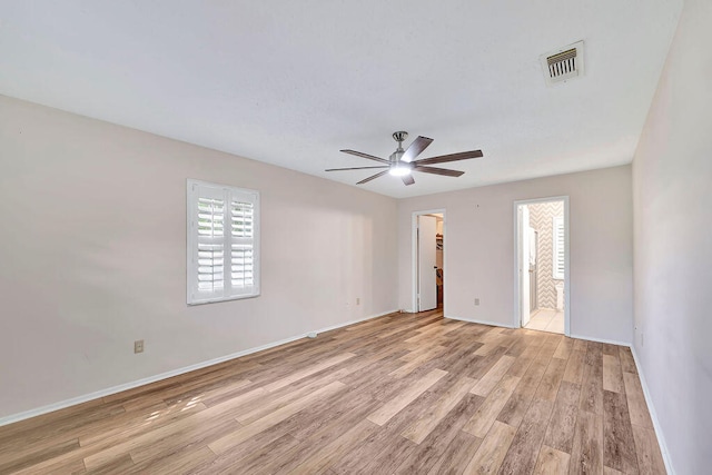 spare room with light hardwood / wood-style floors and ceiling fan