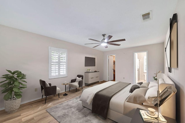 bedroom with light hardwood / wood-style floors and ceiling fan