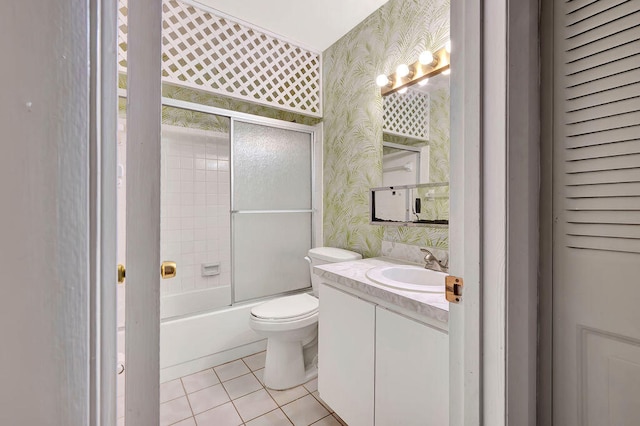 full bathroom with vanity, toilet, tile patterned floors, and combined bath / shower with glass door