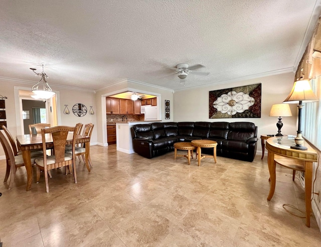 living room with ceiling fan, a textured ceiling, and crown molding