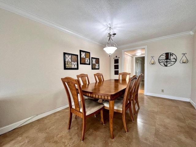 dining area featuring a textured ceiling and crown molding