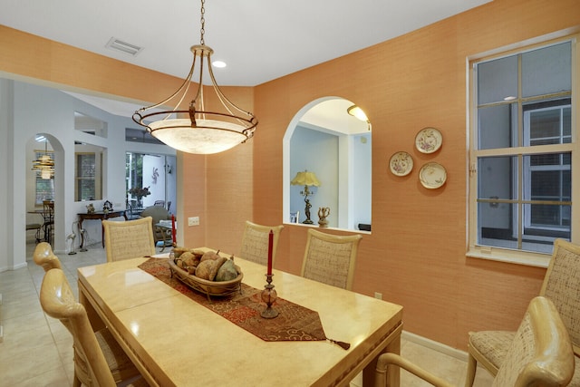 dining space featuring light tile patterned floors