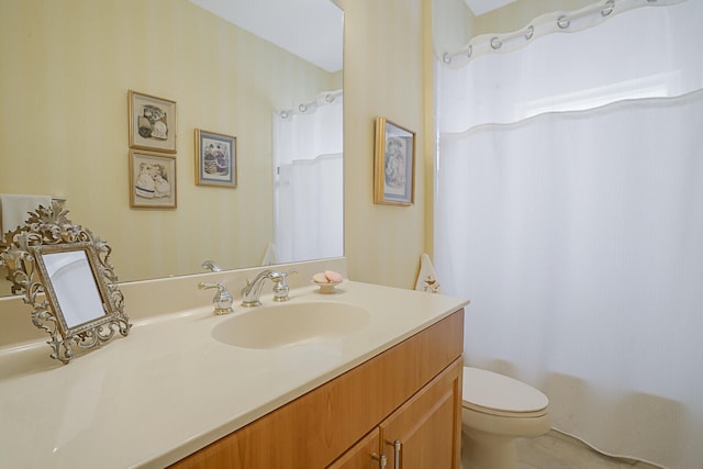 bathroom with vanity and toilet