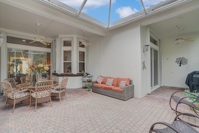 sunroom / solarium with ceiling fan