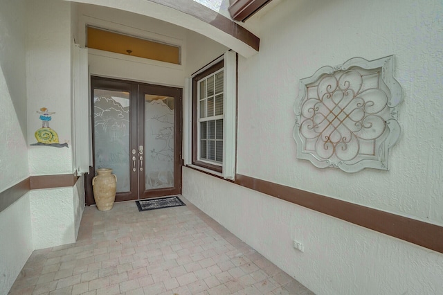 property entrance featuring french doors