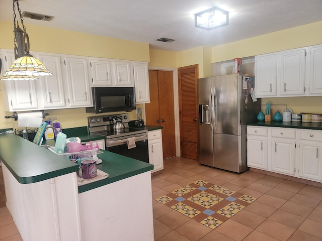 kitchen with stainless steel appliances, white cabinets, kitchen peninsula, and light tile patterned floors