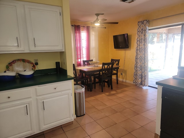 dining space with ceiling fan and light tile patterned floors