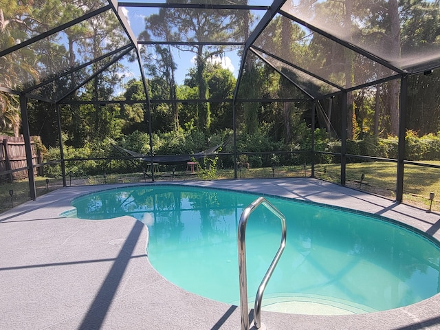 view of pool with a lanai and a patio area