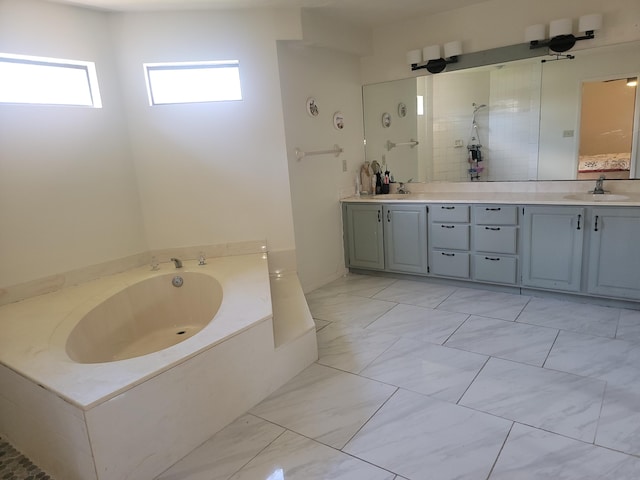 bathroom featuring vanity and separate shower and tub