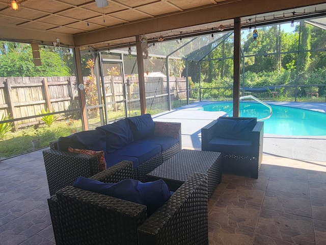 exterior space featuring a fenced in pool, an outdoor living space, and glass enclosure