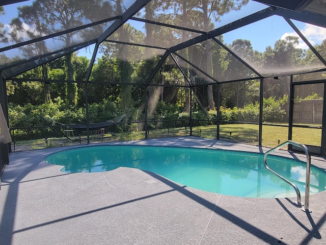 view of pool with a lanai and a patio area