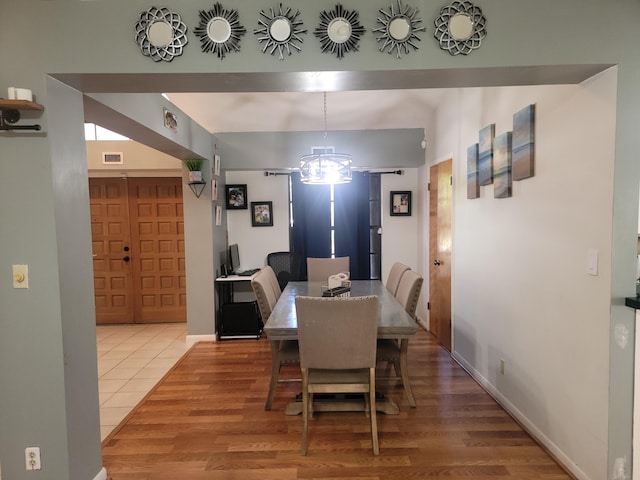 dining room with wood-type flooring