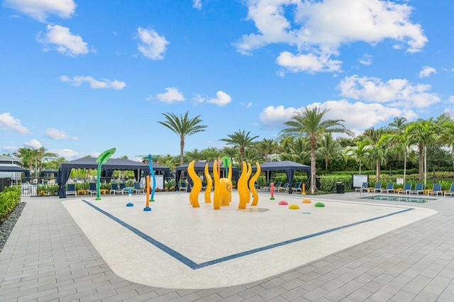 view of play area with a gazebo and a community pool