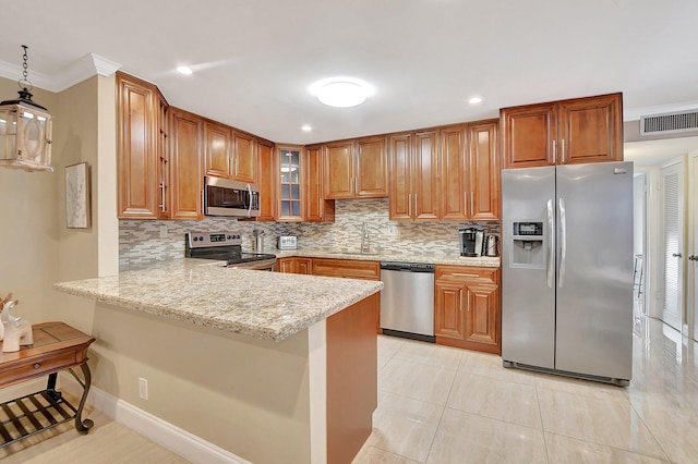 kitchen with stainless steel appliances, kitchen peninsula, crown molding, and sink