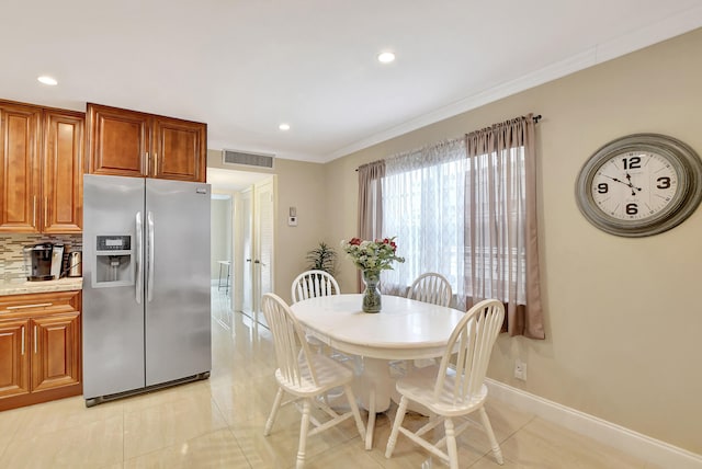 tiled dining area with ornamental molding