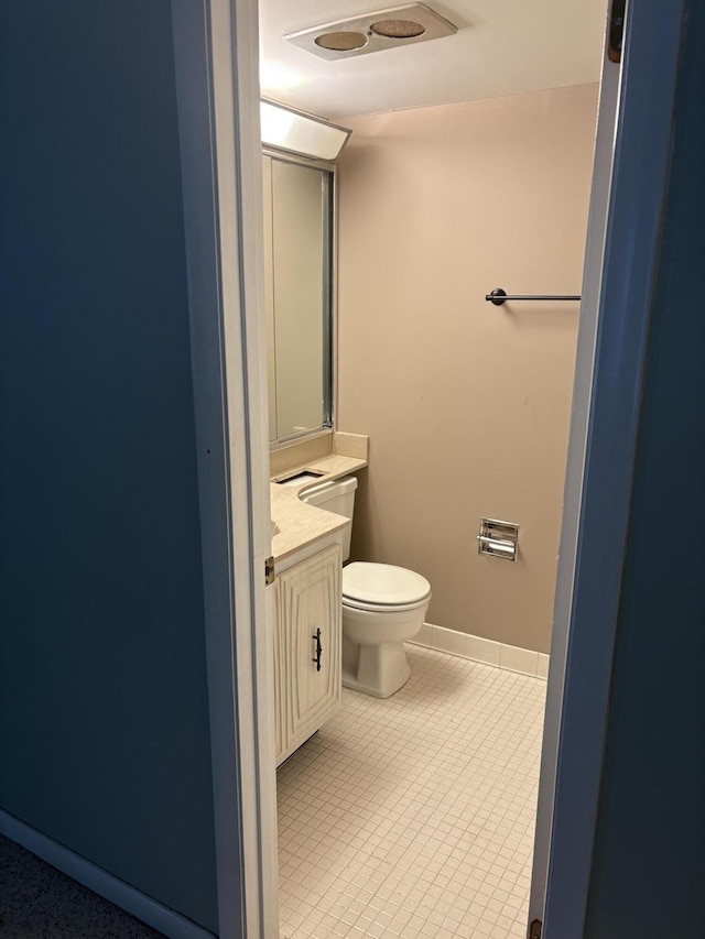 bathroom featuring toilet and vanity